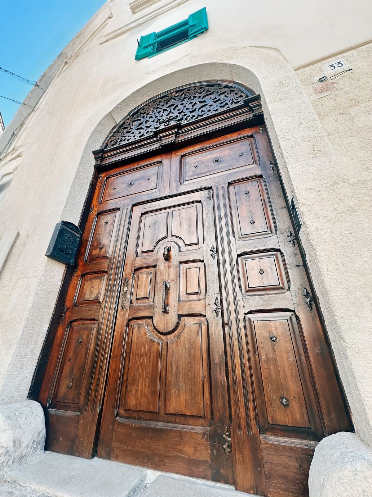 The palazzo door, looking up from the street.