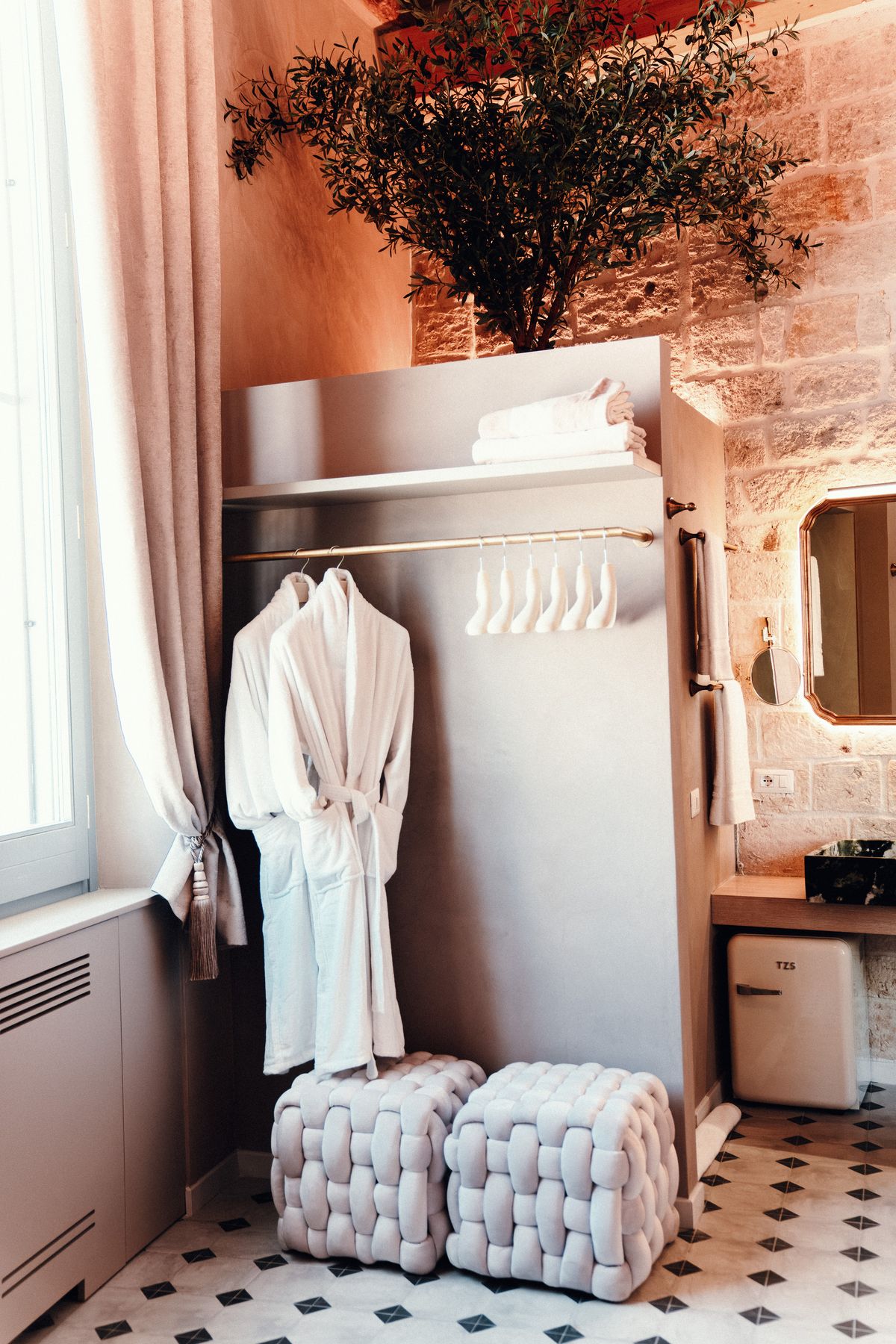 Robes, woven poufs and the olive tree.