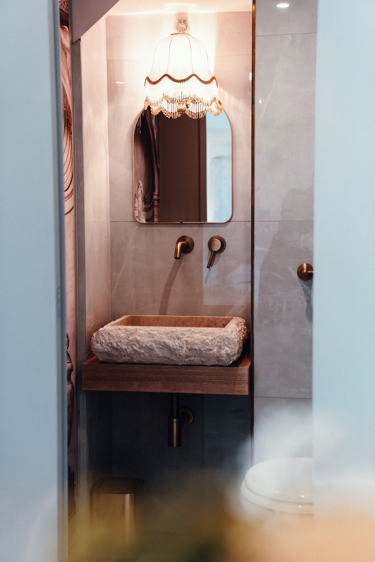 The stone basin in its niche.