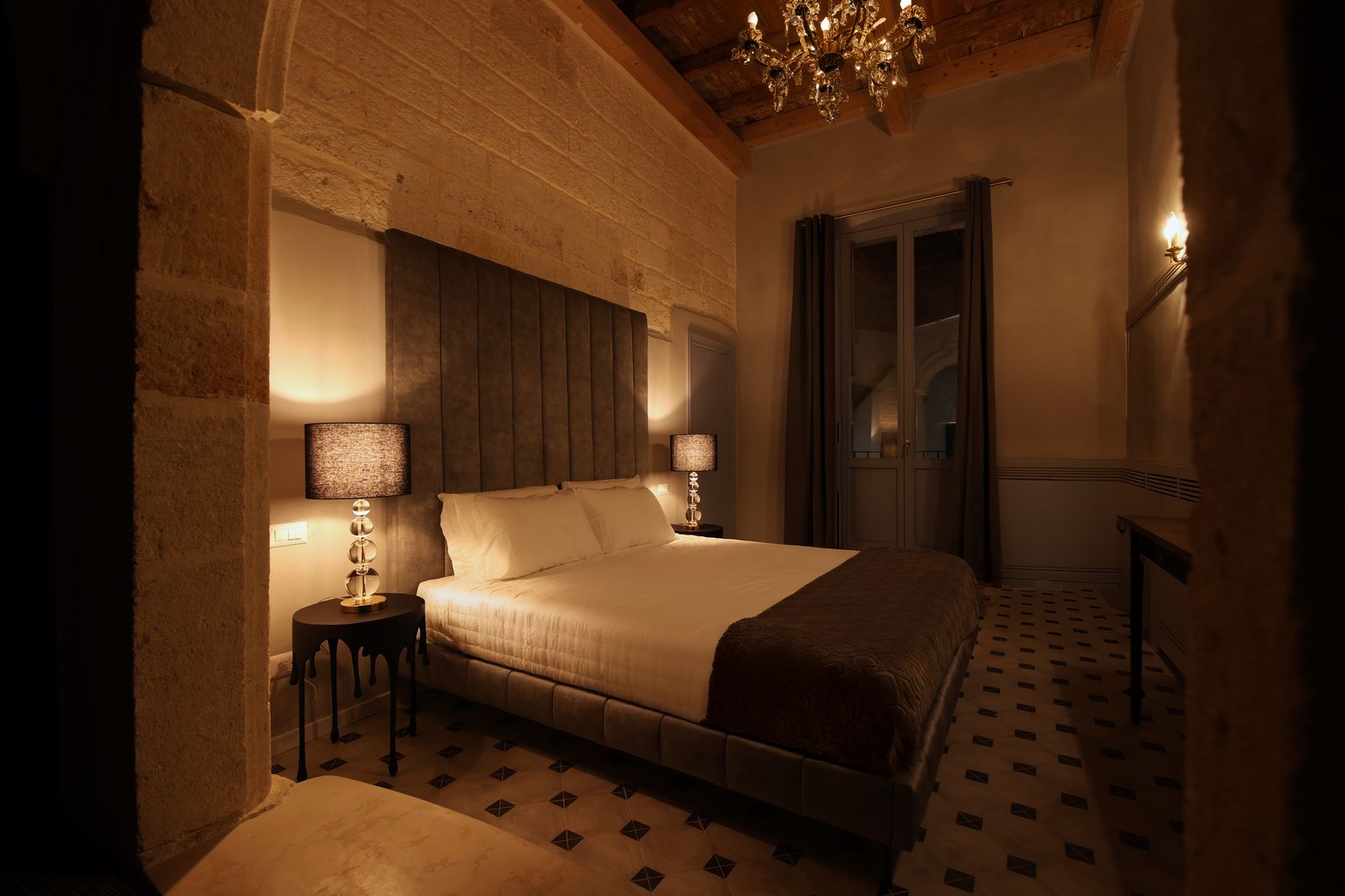 The bed at night, the doorway beyond.