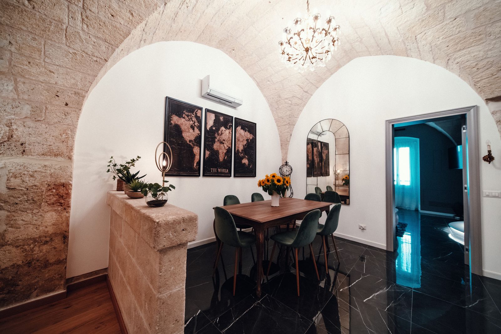 The dining room under the stone arches.